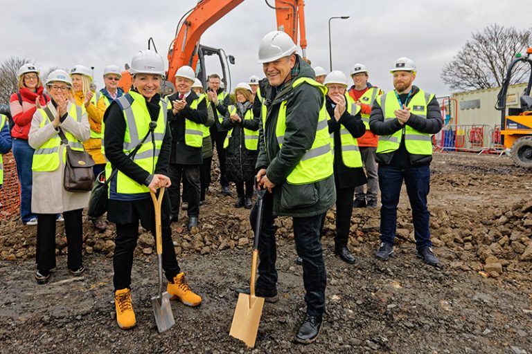 Building site. First spade in the ground with Rachel.